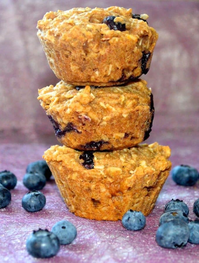 a stack of 3 blueberry breakfast bite muffins