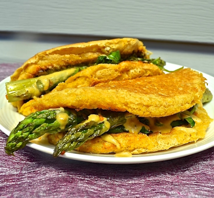 Light and fluffy vegan omelette with deep, earthy chickpea flavour, stuffed to bursting with delicious sautéed vegetables & cashew cheese.