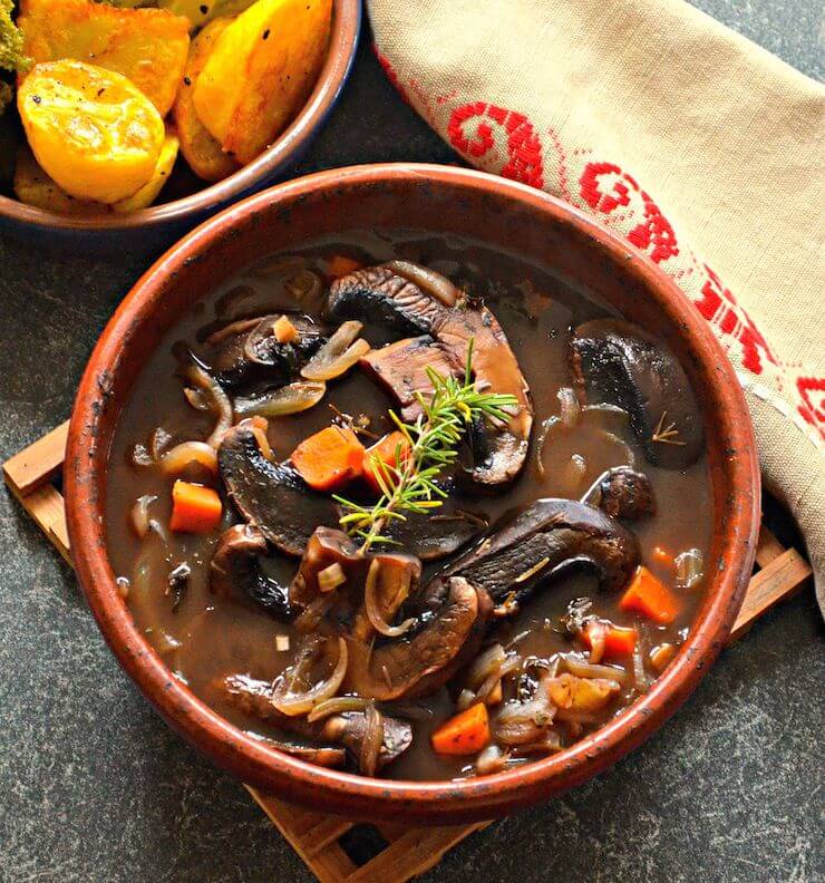 Rich and hearty Portobello Pot Roast. Meaty portobello mushrooms, red wine, herbs & vegetables combine to make a delicious plant-based feast.