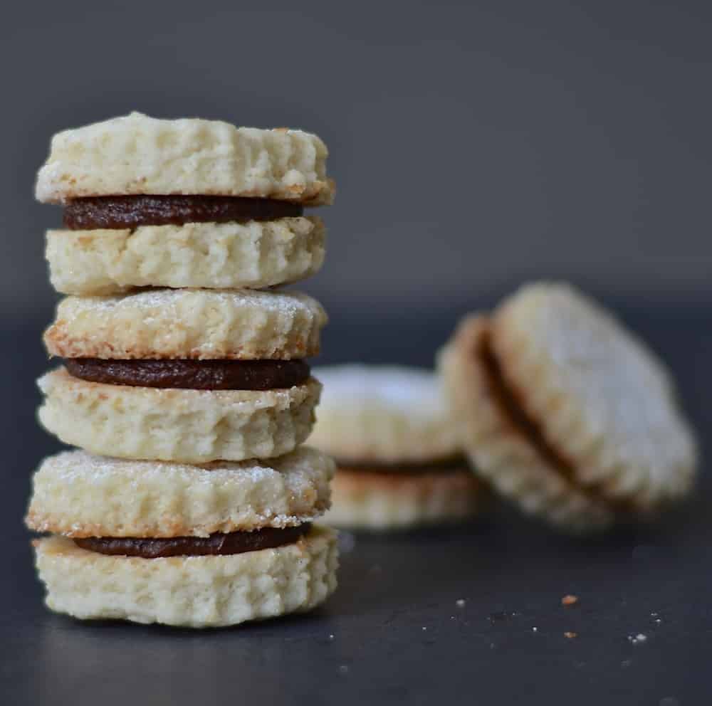 Melt in the mouth Vegan Coconut Cookies with Chocolate Cream. Beautifully short morsels of deliciousness! 