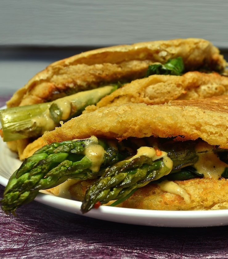 Light and fluffy vegan omelette with deep, earthy chickpea flavour, stuffed to bursting with delicious sautéed vegetables & cashew cheese.