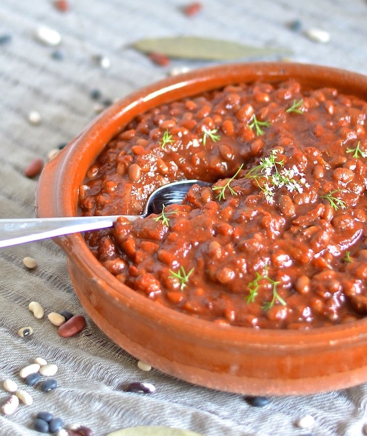 These thick, sweet & smoky slow cooked vegan baked beans need a little initial prep then you can leave them to do their thing while you do yours. You will be rewarded with a comforting & delicious pot of the most amazing baked beans with rich, deep & complex flavours.