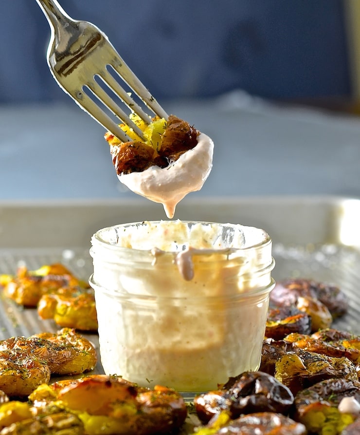 Take the humble potato to a whole new level with these extra crispy Dilly Smashed Baby Potatoes. Roasted, smashed, then roasted some more, their golden nubbliness is just irresistible. Serve them dripping in my mild & creamy horseradish sauce. Potato perfection.....