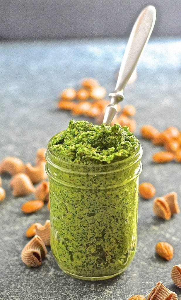 Kale Almond Vegan Pesto in a jar with a spoon