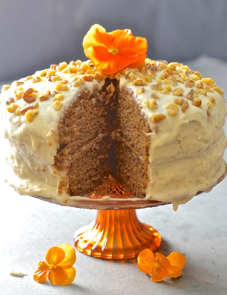 Tender, moist nutty sponge sandwiched together with creamy maple infused frosting. Completely dairy, egg & oil free but perfectly sweet & decadent, this maple walnut cake is total perfection!