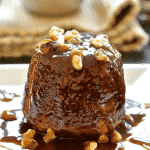 Moist & flavourful Sticky Banana Date Pudding with a spoon-licking, boozy, rum caramel sauce. Rich, delicious & truly indulgent! Made individually, these little puddings are baked in the oven & are no more difficult to make than muffins. Plus they can be made in advance & freeze perfectly. Great for making ahead!