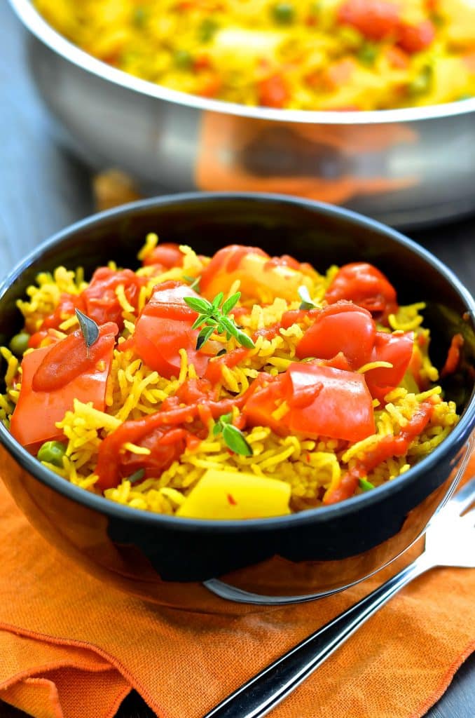 This One-Pot Spicy Vegetable Rice is our go to favourite mid-week dinner. 3o minutes & one pot is all that is standing between you & a big bowl full of deliciously spiced, flavourful rice studded with sweet, soft veggies.