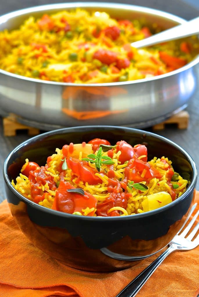 This One-Pot Spicy Vegetable Rice is our go to favourite mid-week dinner. 3o minutes & one pot is all that is standing between you & a big bowl full of deliciously spiced, flavourful rice studded with sweet, soft veggies.