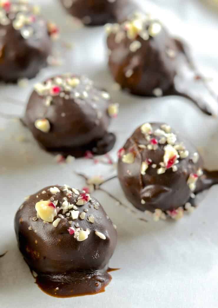 These festive Vegan White Chocolate Candy Cane Truffles are meltingly rich, sweet, creamy & indulgent. Total and utter decadence with minimal effort. A chocoholics dream!