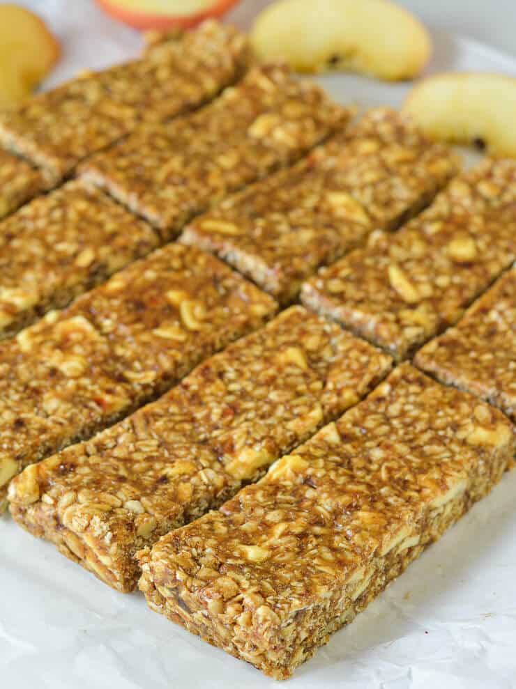 No-Bake Cinnamon Apple Energy Bars with apple slices in background