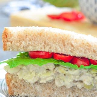 Tuck a napkin into your collar because you're gonna need it when you bite into a big, thick doorstep of a sandwich stuffed to bursting with this creamy Smashed White Bean & Artichoke Vegan Sandwich Filling!