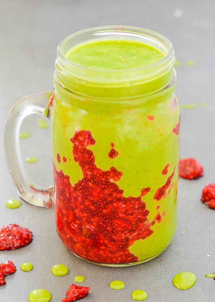 A sweet, creamy Peanut Butter & Jelly Smoothie stuffed with all sorts of healthy ingredients plus a beautiful smear of homemade raspberry chia jam. The perfect satisfying breakfast or snack!
