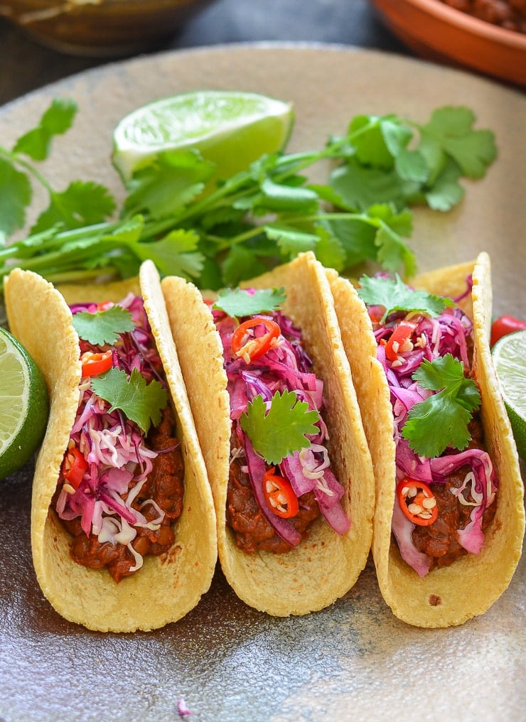 Rich & tasty Enchilada Lentil Tacos topped with zesty lime slaw. A full on flavour sensation!