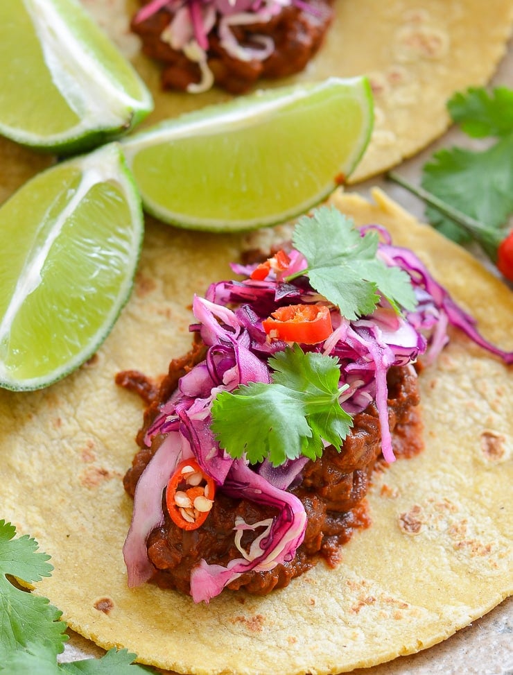 Enchilada Lentil Tacos topped with zesty and pretty in pink lime slaw. They taste as good as they look!