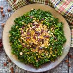 massaged kale salad scattered with savoury granola