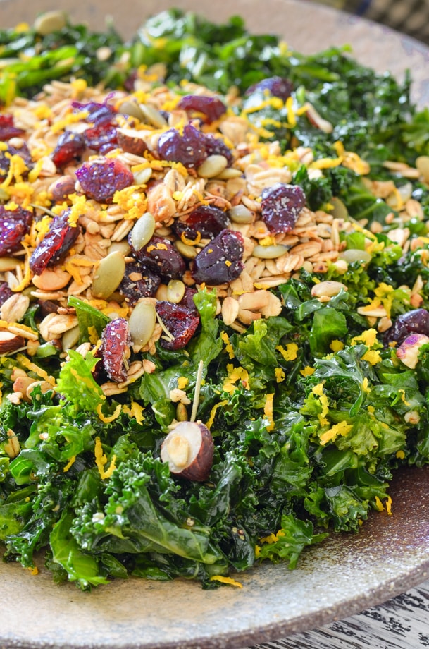close up shot of massaged kale salad with nutty, crispy, crumbly savoury granola