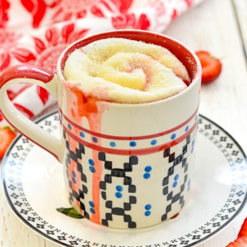 a strawberry sweet roll in a mug