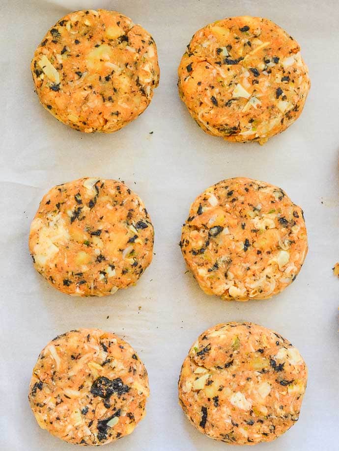 Thai Style Vegan Crab Cakes. Uncooked & laid out on a tray.