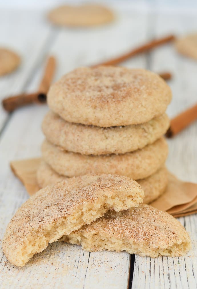 perfect Vegan Snickerdoodles. A stack and one broken in two showing the inside. 