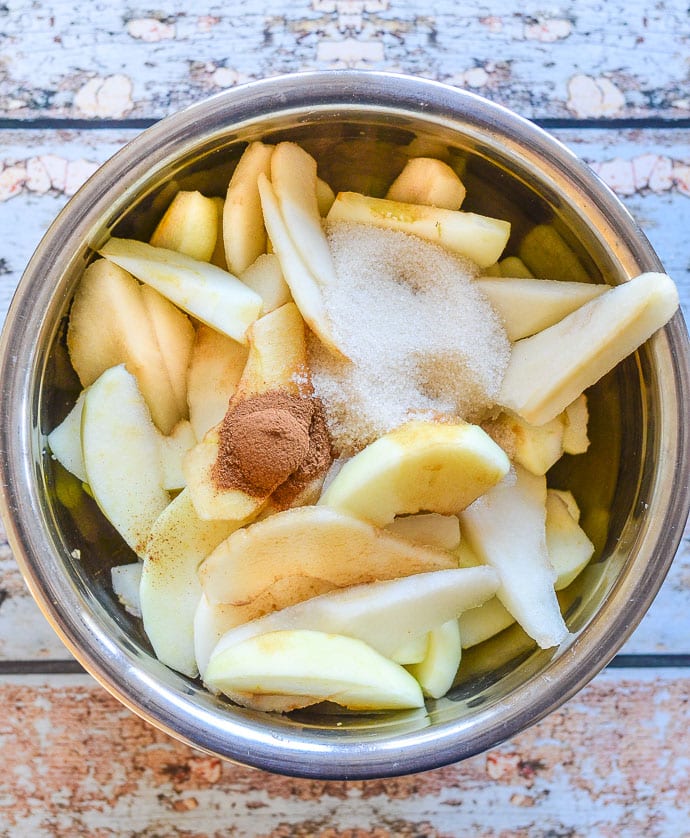 Apples & pears with cinnamon and sugar in a bowl
