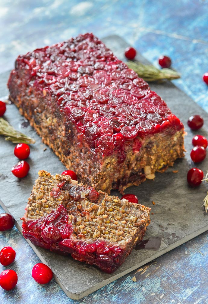 Mushroom Lentil Loaf on a slate board with one slice cut off the end