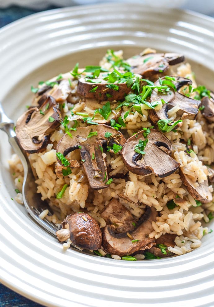 Close up shot of Easy Oven Baked Garlic Mushroom rice in a bowl