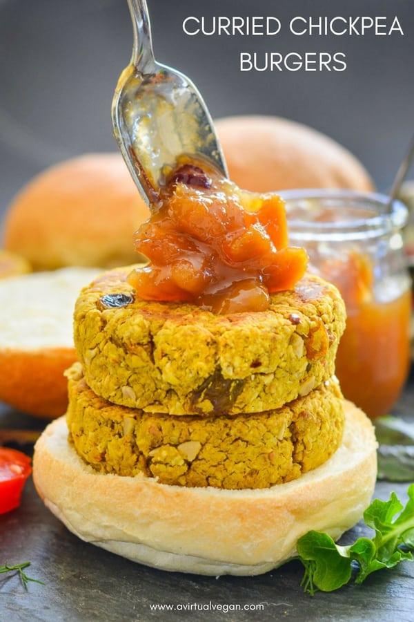 Quick & easy Curried Chickpea Burgers. They are full of curry flavour with bursts of sweetness from plump golden raisins and texture from chopped cashew nuts & chewy oats. Serve them in buns with a generous dollop of mango chutney! #veggieburger #chickpeas #curryburger #curry #vegan #chickpeaburger
