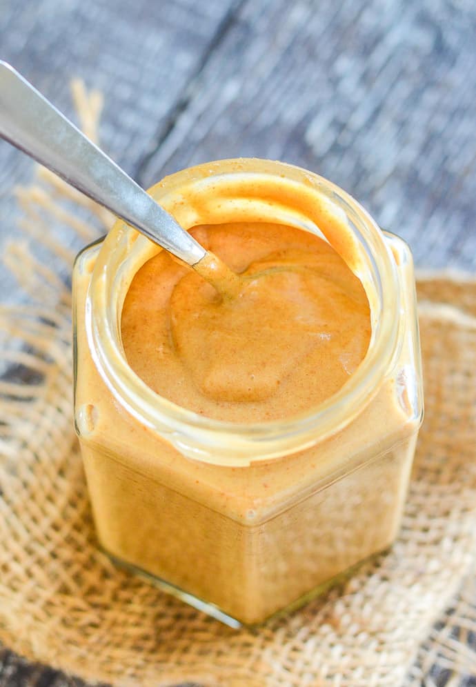 Dat Caramel with spoon in a glass jar