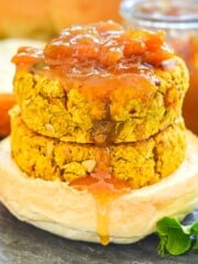 stacked curried chickpea burgers drizzled in mango chutney.