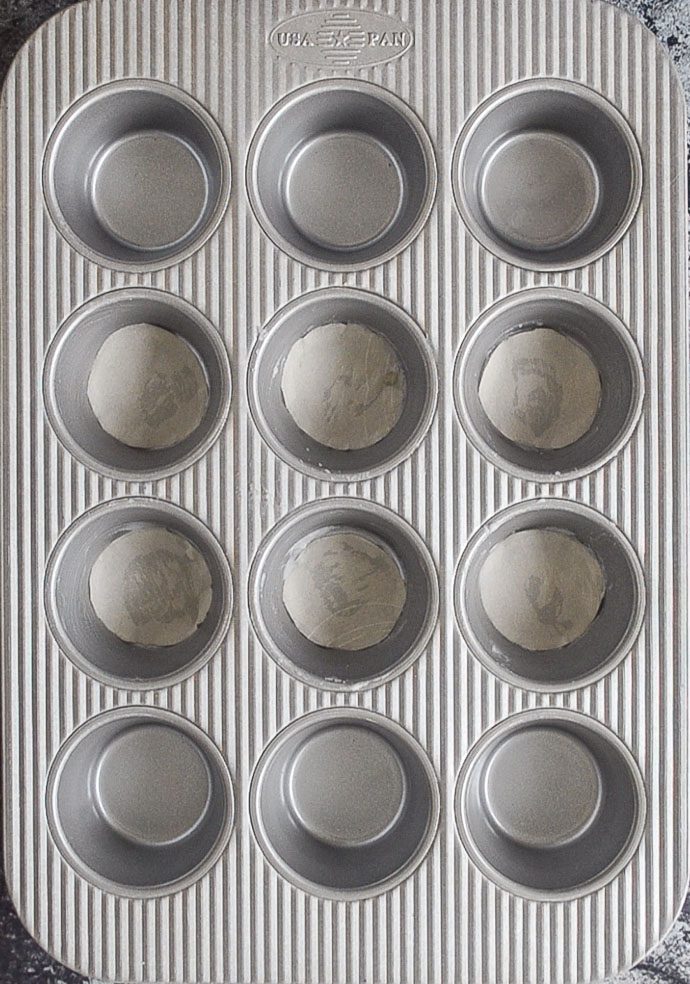 a greased muffin pan
