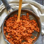 a skillet of sticky BBQ baked beans