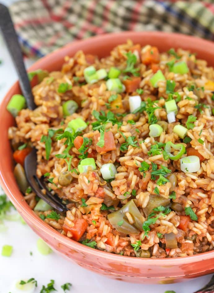 Teriyaki Instant Pot rice in a bowl topped with chopped parsley and green onions