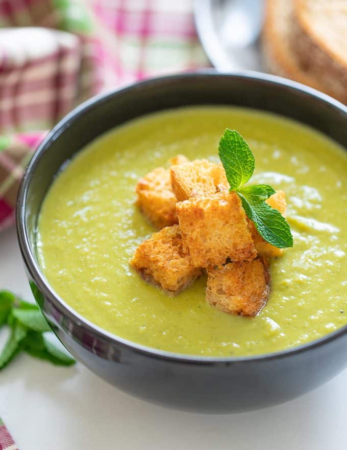 A bowl of brilliant green goodness to warm your soul! This Green Pea Soup with a generous handful of mint for good measure, is healthy, low calorie, packed with protein and super simple to make. With only 6 ingredients (plus salt & pepper) you probably already have everything you need to make it too!