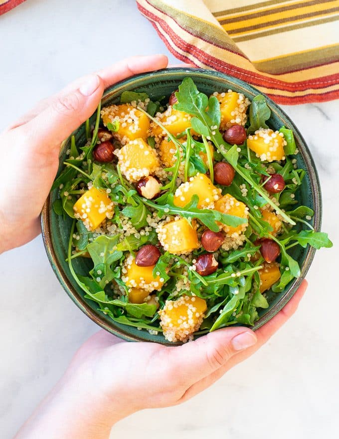 A fresh & juicy Butternut Squash Salad with sweet, roasted butternut squash pieces, peppery arugula, crunchy toasted hazelnuts, a grain of your choosing and a super delicious apple cinnamon dressing to bring it all together. It makes a lovely lunch, light dinner or side.