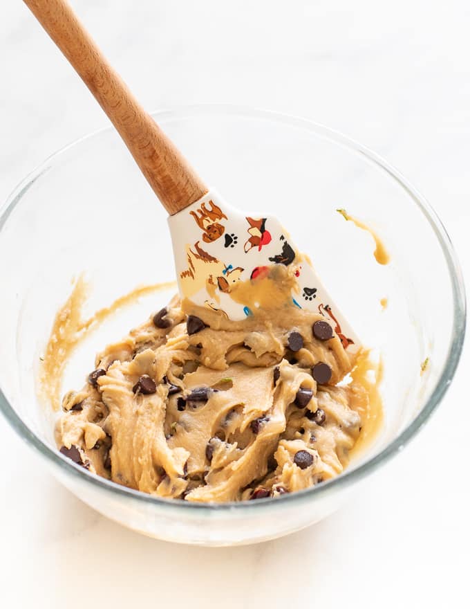 Vegan Chocolate Chip Cookie dough in a bowl with spatula