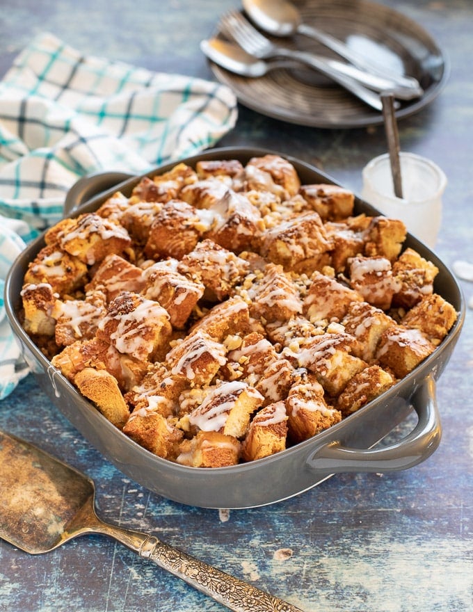 Make your brunch dreams come true with this Vegan French Toast Casserole. Cubes of crusty bread are drowned in cinnamon infused custard and baked until crispy & toasty on top & soft and custardy (but not soggy!) underneath. Then comes the drizzle of frosting which takes it over-the-top. It’s perfect for feeding a crowd & can even be prepped the night before if you need to.