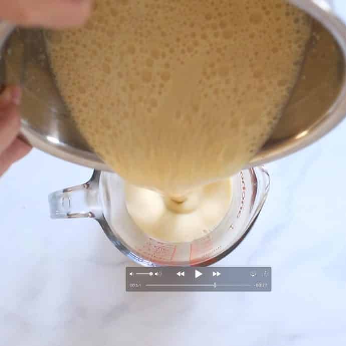 Vegan Yorkshire Pudding batter being poured into a jug