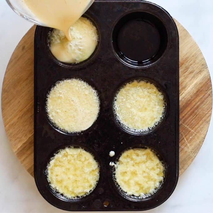 Vegan Yorkshire Pudding batter being poured into hot oil