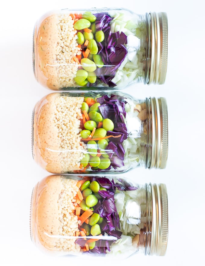 3 layered salads in jars, laid down and taken from above