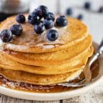 vegan gluten free pancakes with maple syrup and blueberries