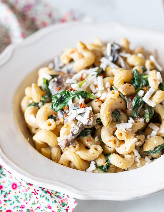 Creamy Vegan Mushroom Pasta with spinach in a bowl
