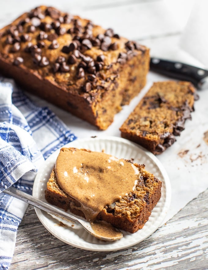 a slice of banana bread spread with almond butter.  