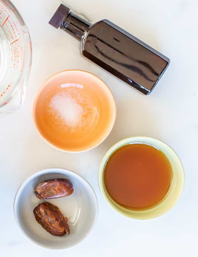 vanilla. salt, maple syrup and dates in small bowls 