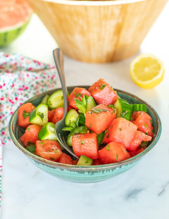 watermelon mint salad in a green bowl