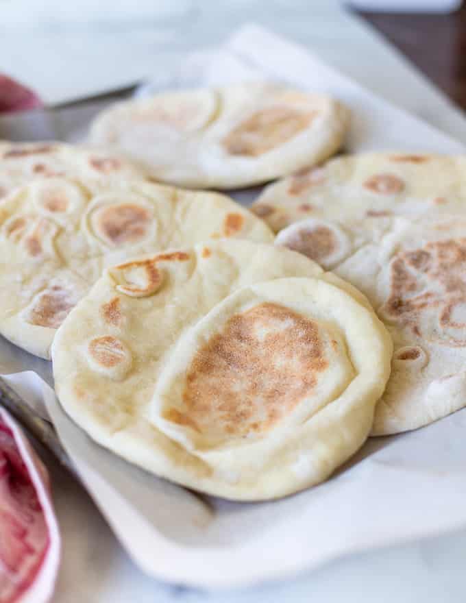 flatbreads laid out on a baking tray