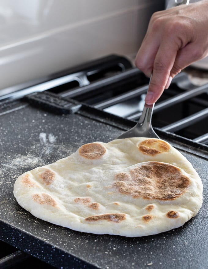 flatbread recipe cooking on a griddle
