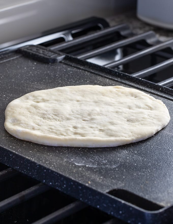 flatbread cooking on a griddle