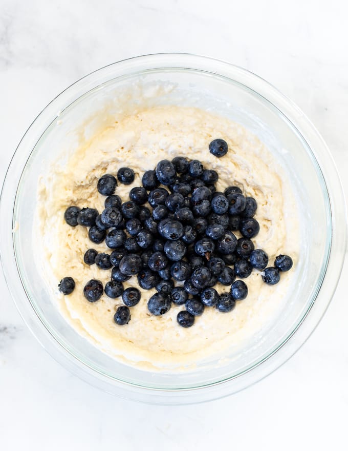 blueberries added to giant vegan pancake batter