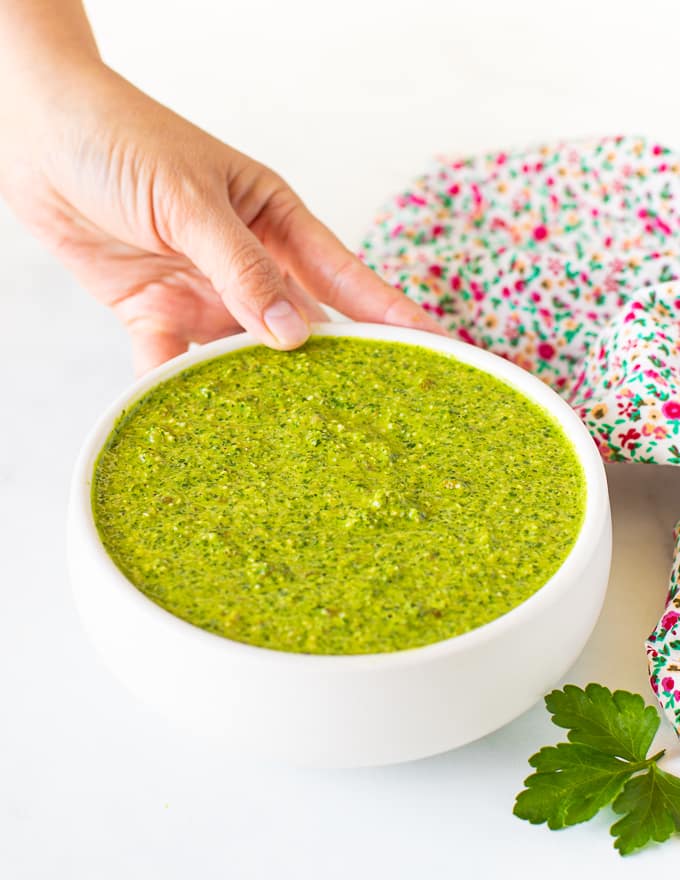 green sauce in a white bowl