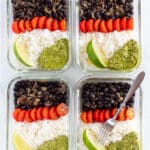 4 glass vegan meal prep containers with rice, black beans, tomatoes and green sauce